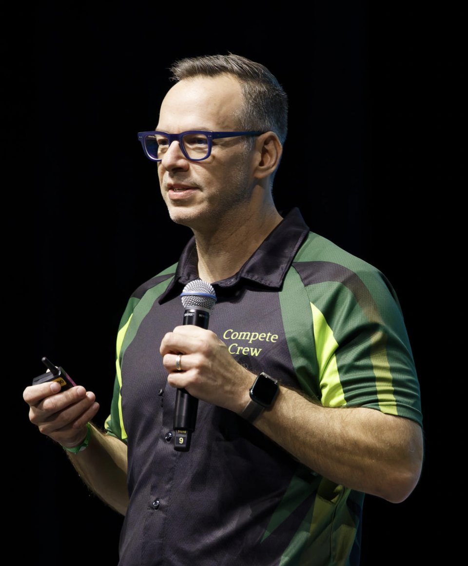 Chris Al-Joundi speaking on stage